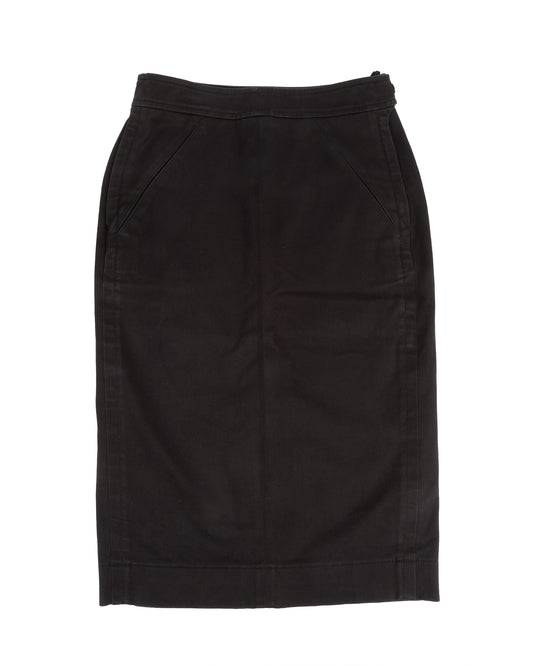 A black riding-inspired pencil skirt with front and back panels, side pockets, and adjustable buttoned tabs at the waistband.