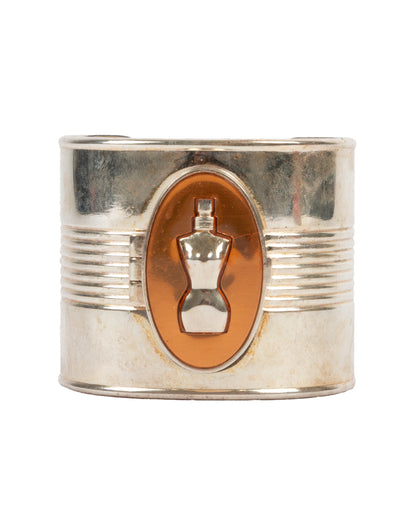 Jean Paul Gaultier Classique Bust Cuff Bangle with a central emblem on a white background