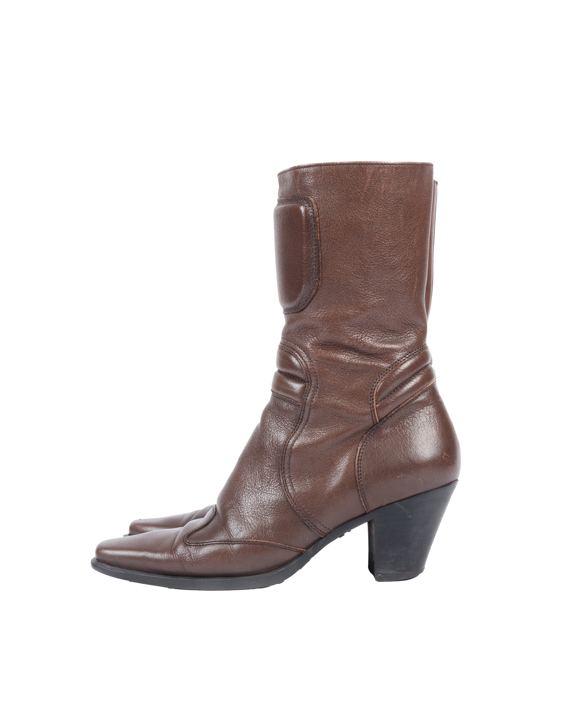 A brown leather mid-calf moto boot with a structured panel and padded details, featuring a squared-off toe and stacked block heel, with visible creasing and minor scuffing.