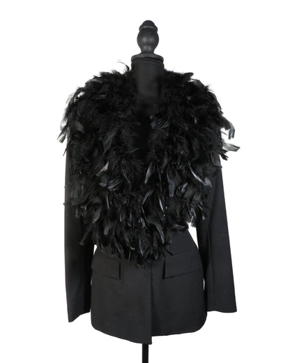 Black feathered jacket on a mannequin against a white background