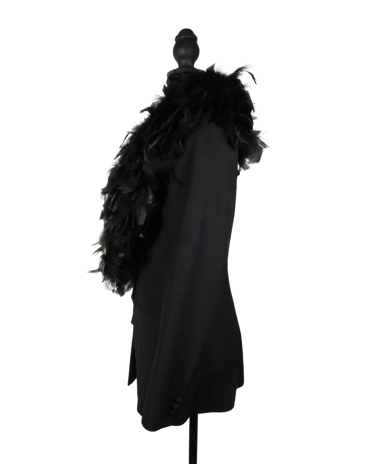 Black coat with feathered hood on a mannequin against a white background