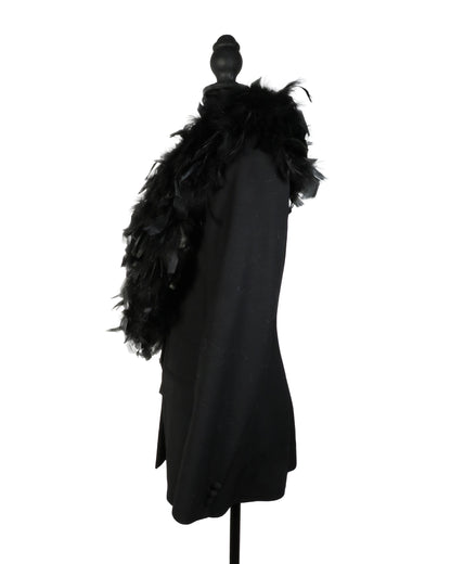 Black coat with feathered hood on a mannequin against a white background