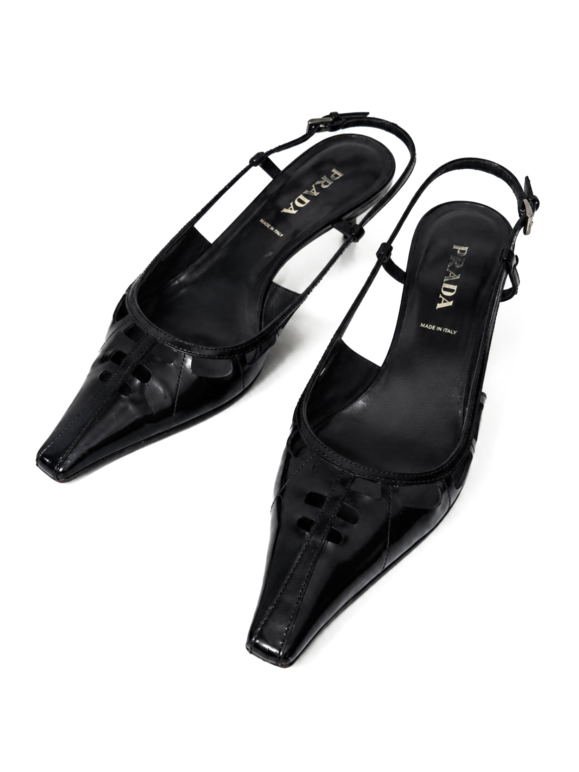 Black high-heeled shoes with Prada logo on a white background