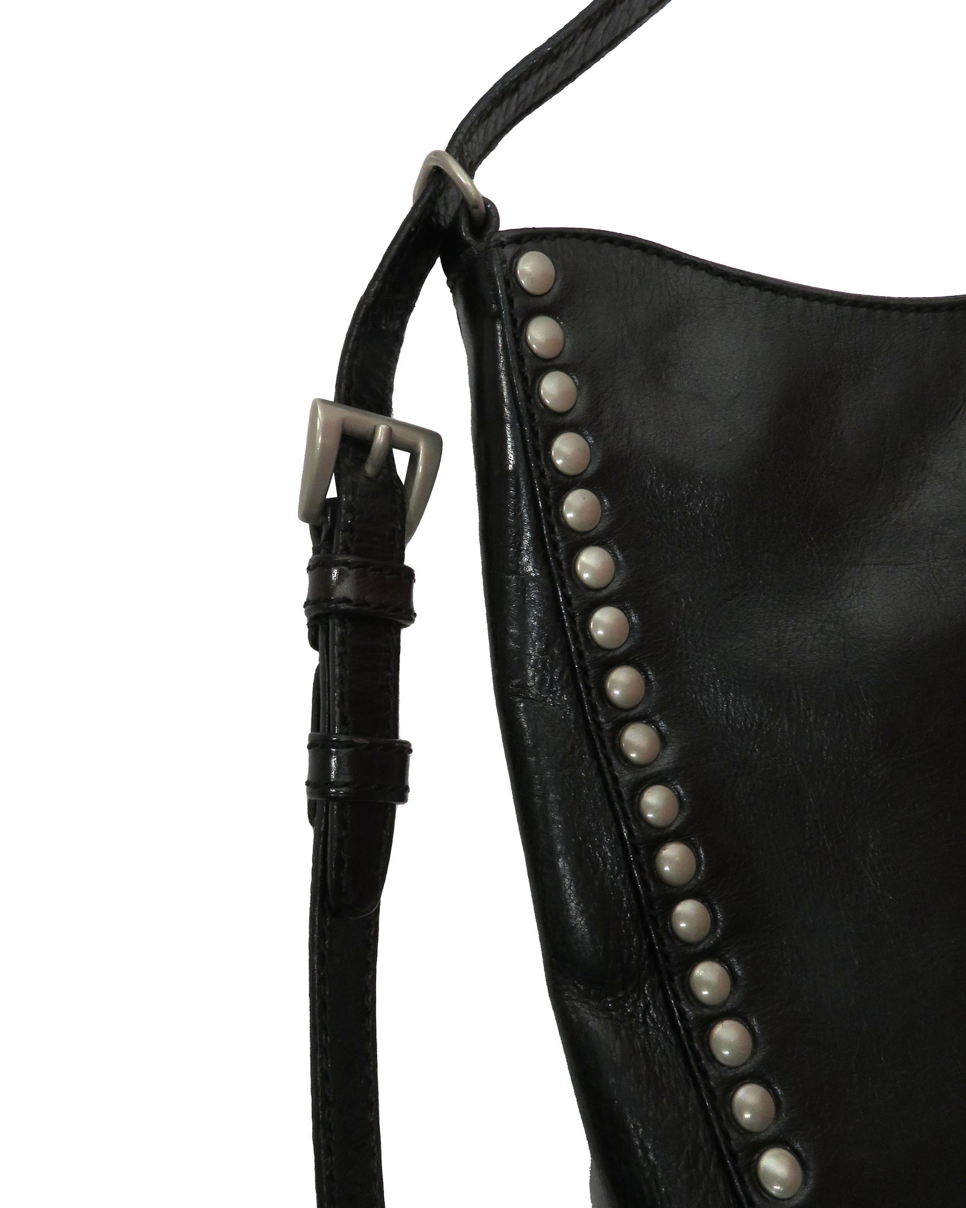 Black leather bag with studded details on a white background