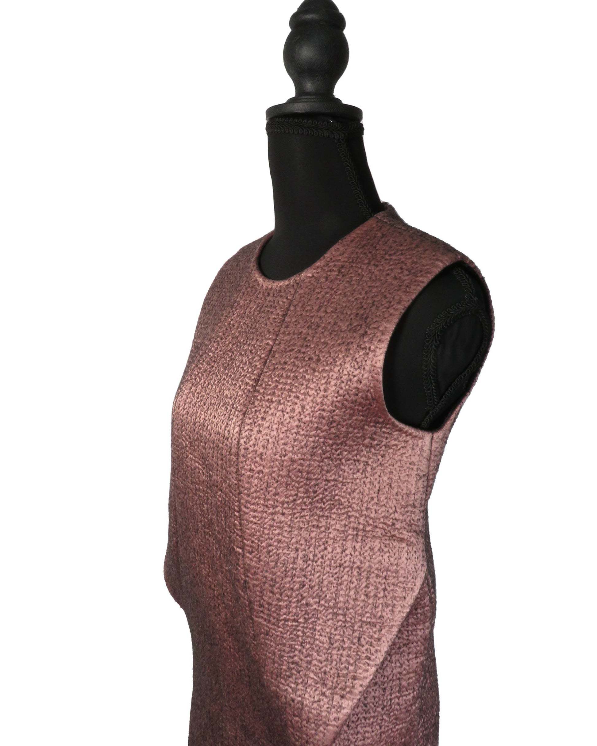 Sleeveless dress on a mannequin against a white background