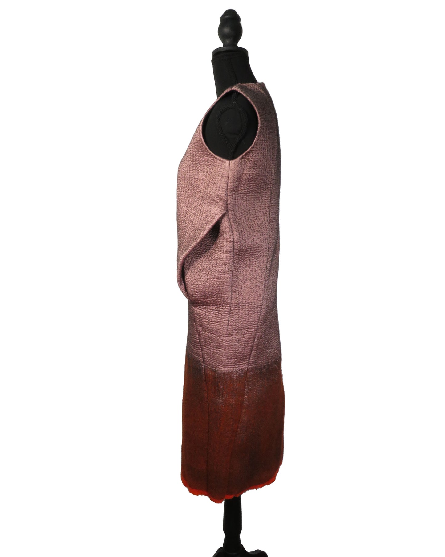 Mannequin wearing a patterned apron on a white background