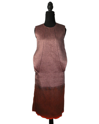 Brown dress on a mannequin against a white background