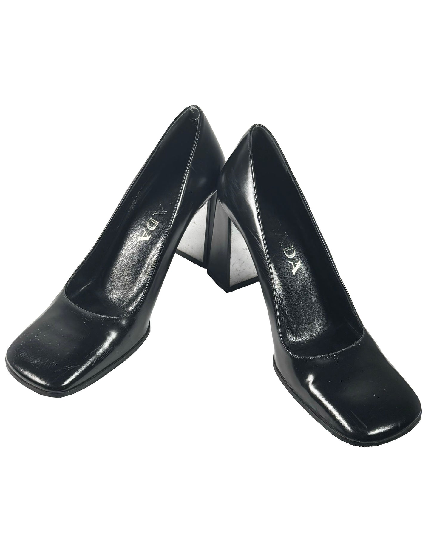 Pair of black high-heeled shoes on a white background