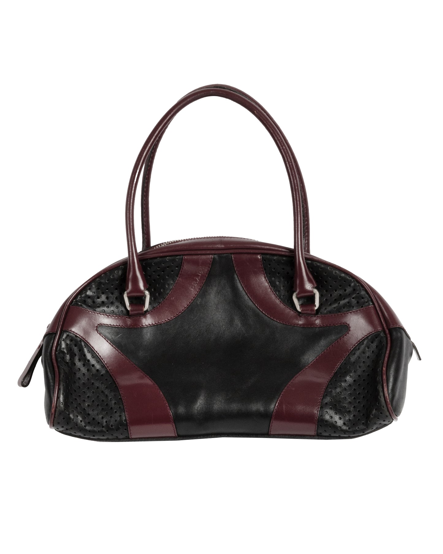 A black and burgundy leather bowling bag with perforated leather paneling and double handles.