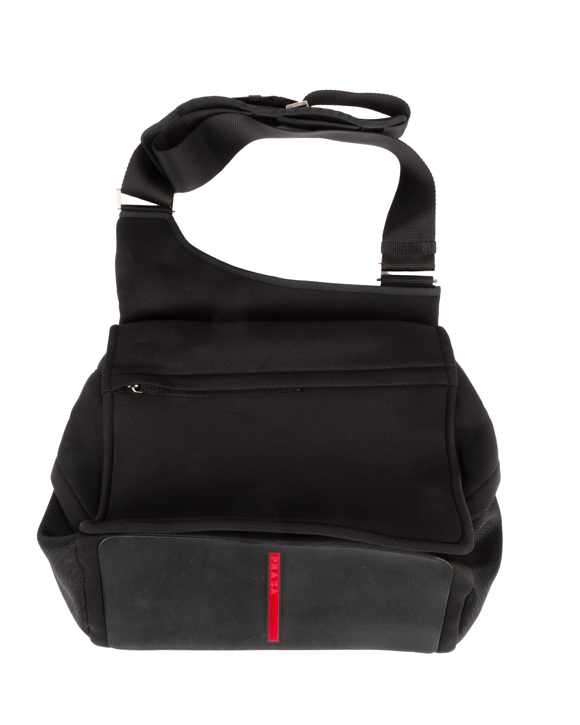 A black nylon shoulder bag with a red line detail on the front pocket and a rubber base.