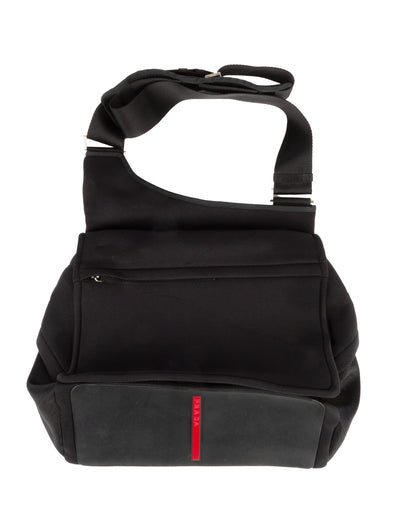 A black nylon shoulder bag with a red line detail on the front pocket and a rubber base.