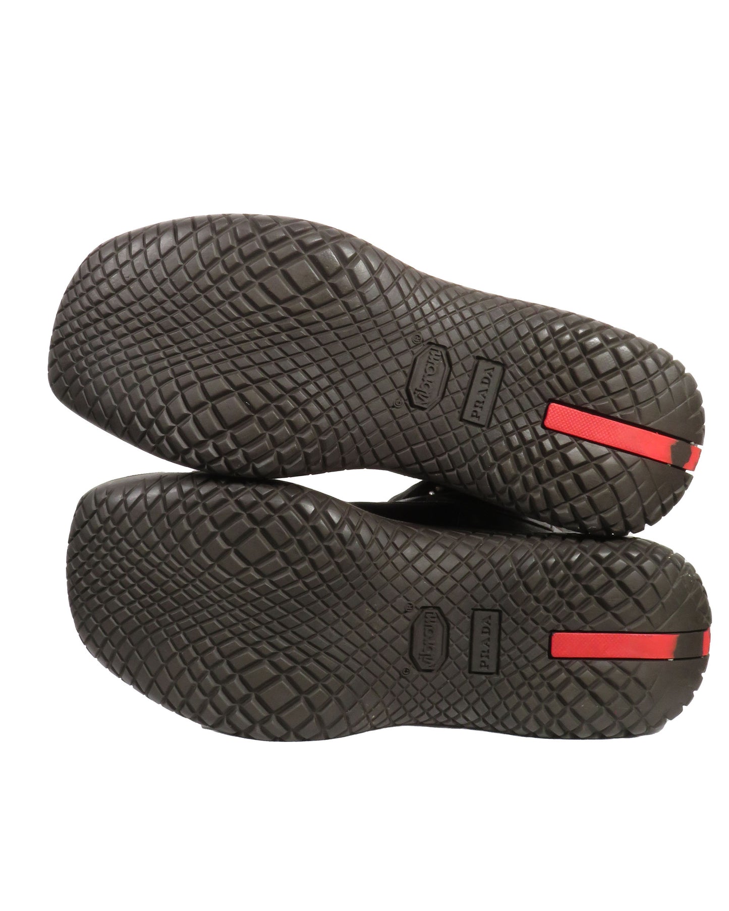 Black shoes with red accents on a white background