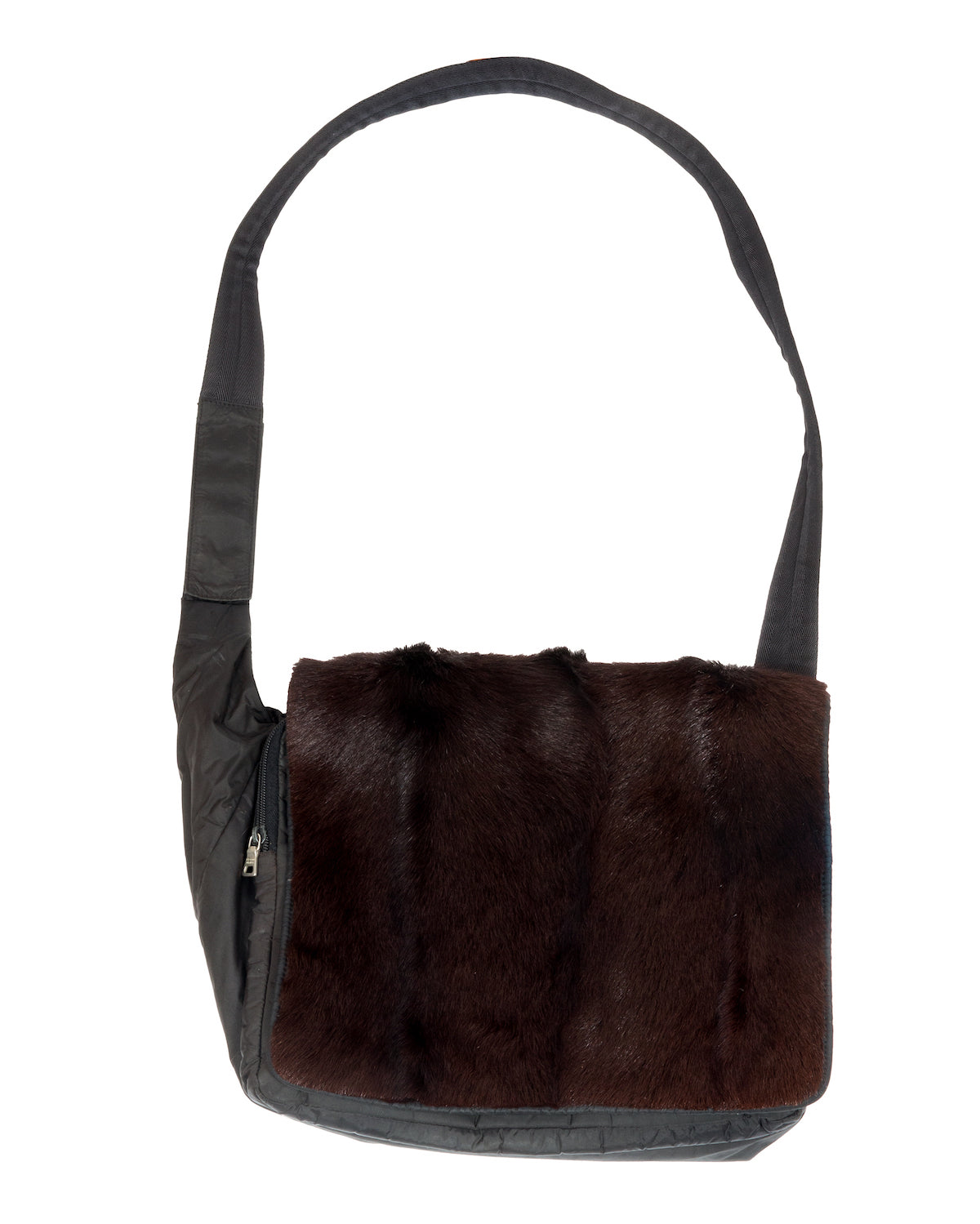 Black nylon messenger bag with brown fur flap, featuring a wide adjustable nylon strap and multiple zippered compartments.