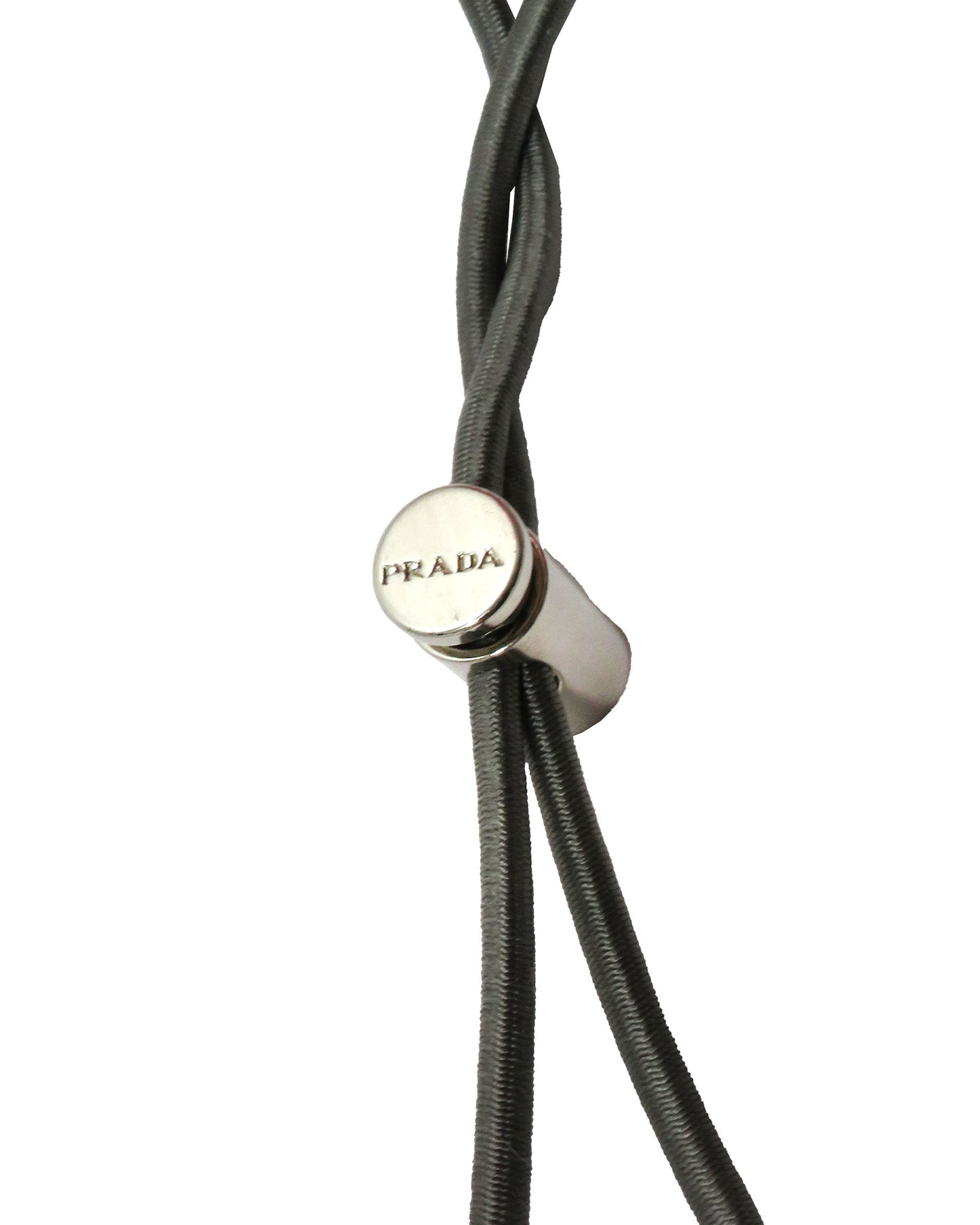 Close-up of a Prada branded cord on a white background