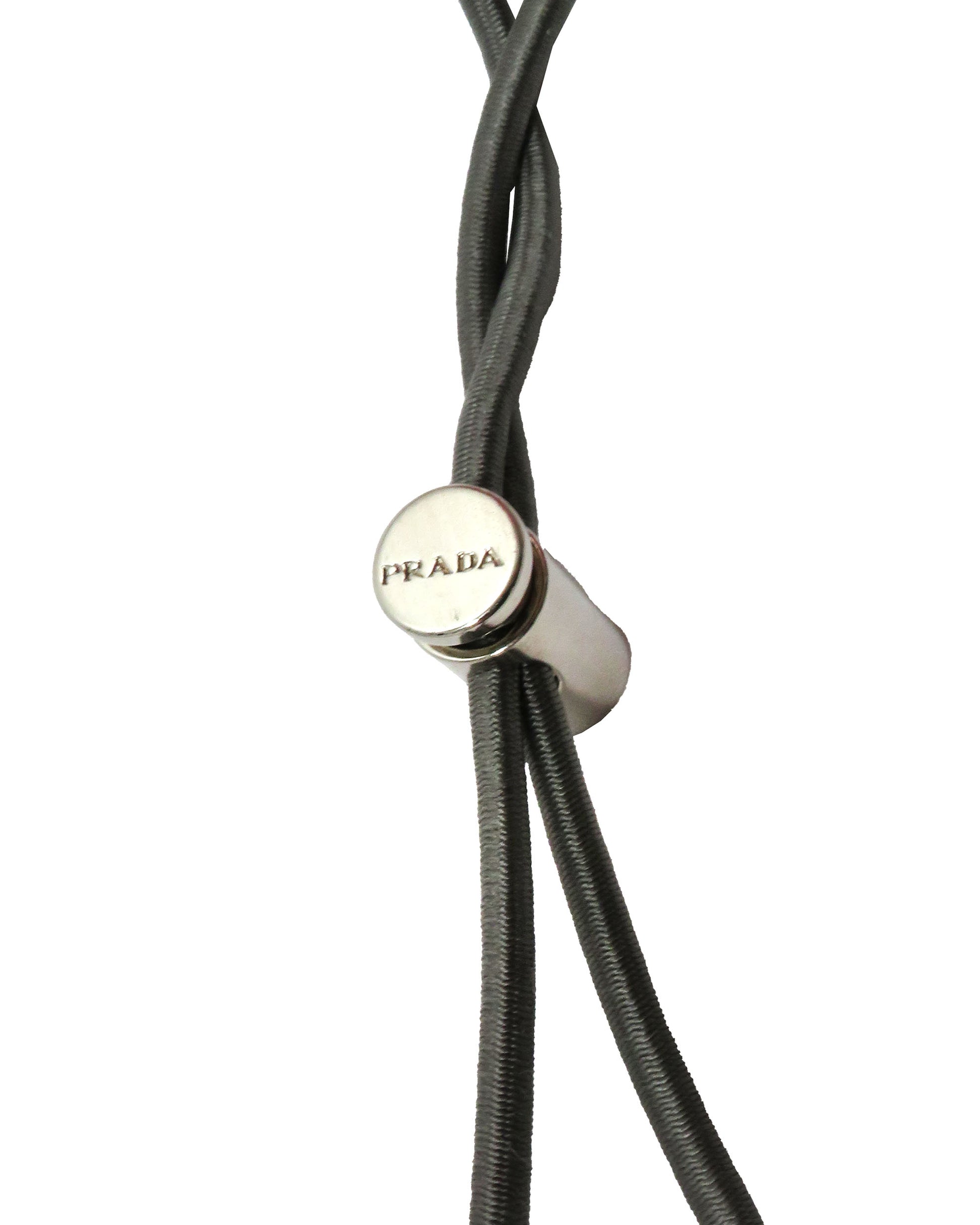 Close-up of a Prada branded cord on a white background
