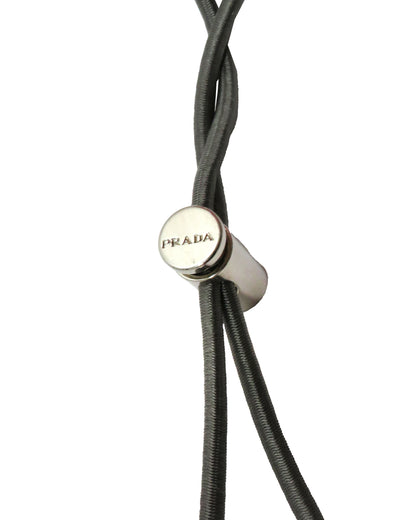 Close-up of a Prada branded cord on a white background