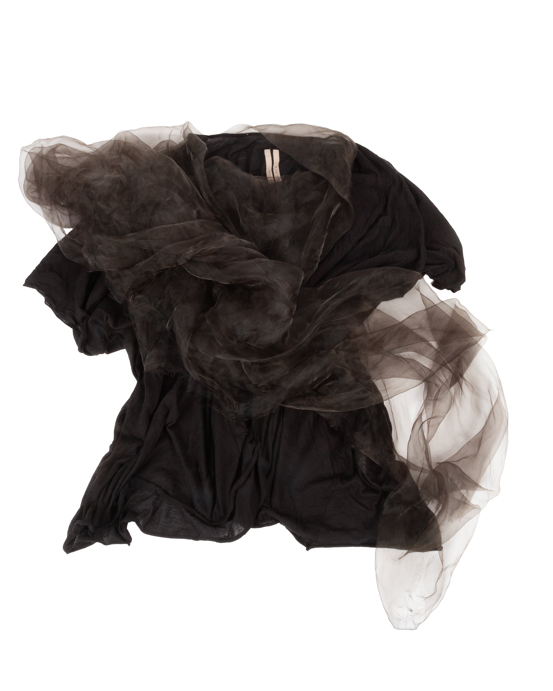 A black draped tulle tunic top with a sheer panel extending from the neckline, featuring short sleeves and a loose silhouette. A long length of tulle trails from the neck down to below the hemline.