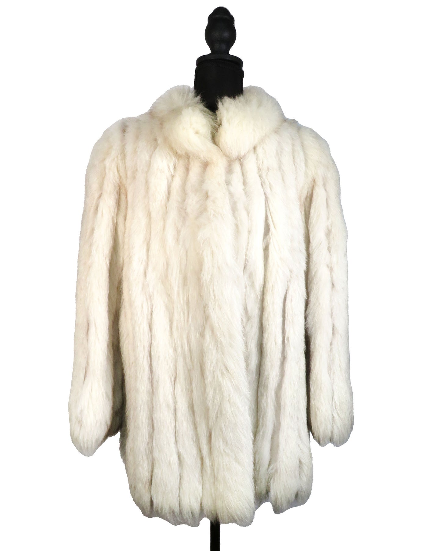 White fur coat on a mannequin against a white background