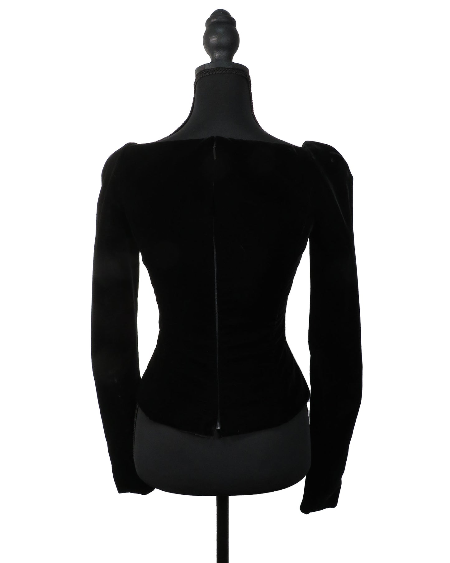 Black velvet jacket on a mannequin against a white background