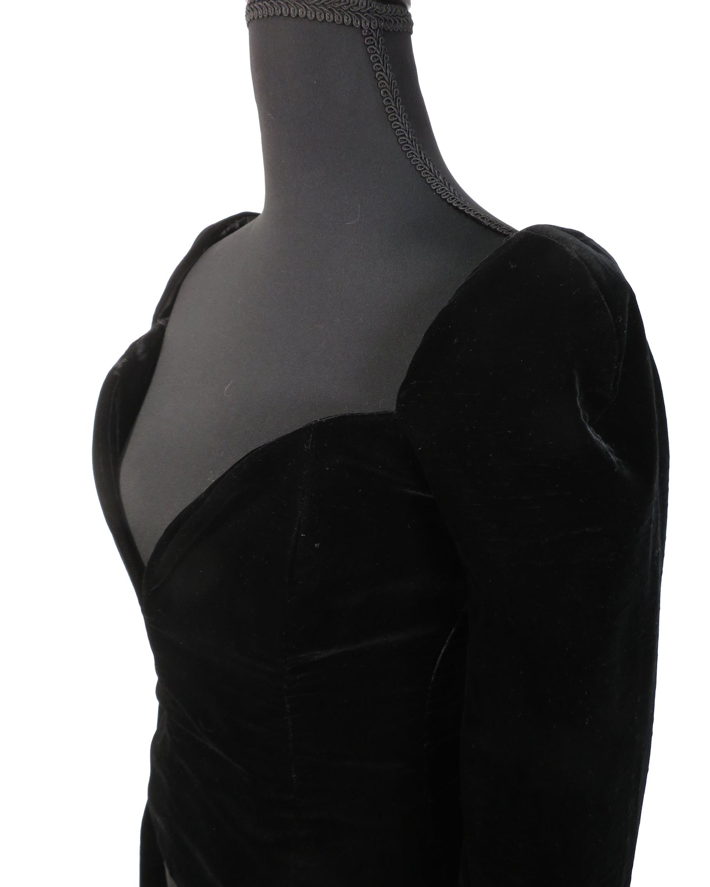 Black velvet dress on a mannequin with sheer overlay