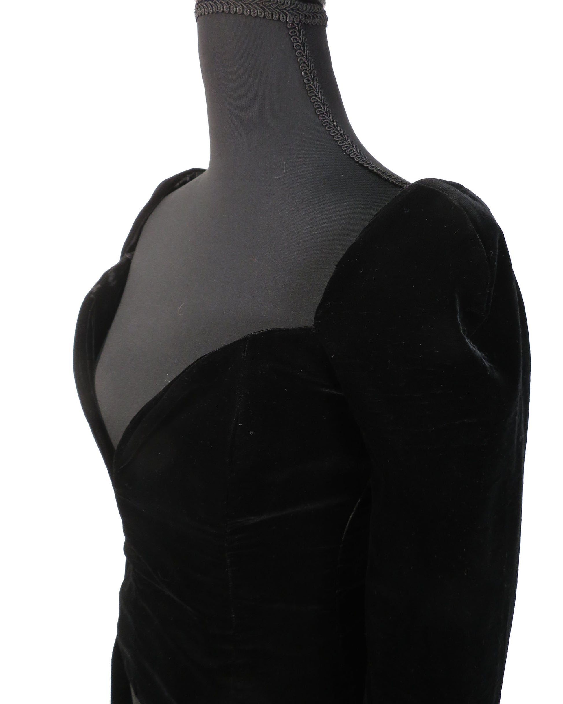Black velvet dress on a mannequin with sheer overlay