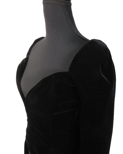 Black velvet dress on a mannequin with sheer overlay