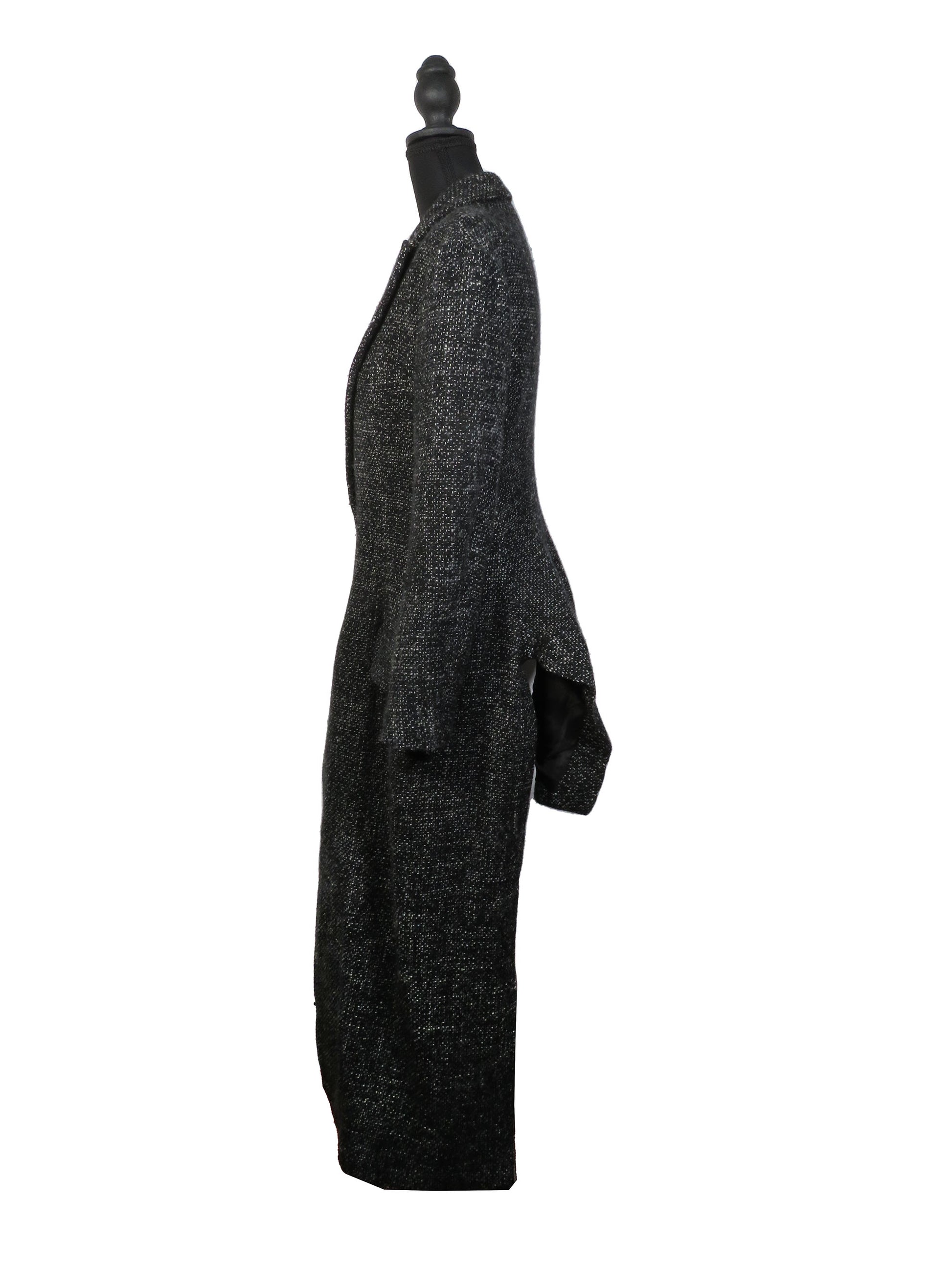 Black textured coat on a mannequin against a white background