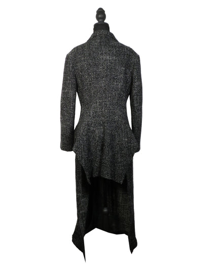 Black textured coat on a mannequin against a white background
