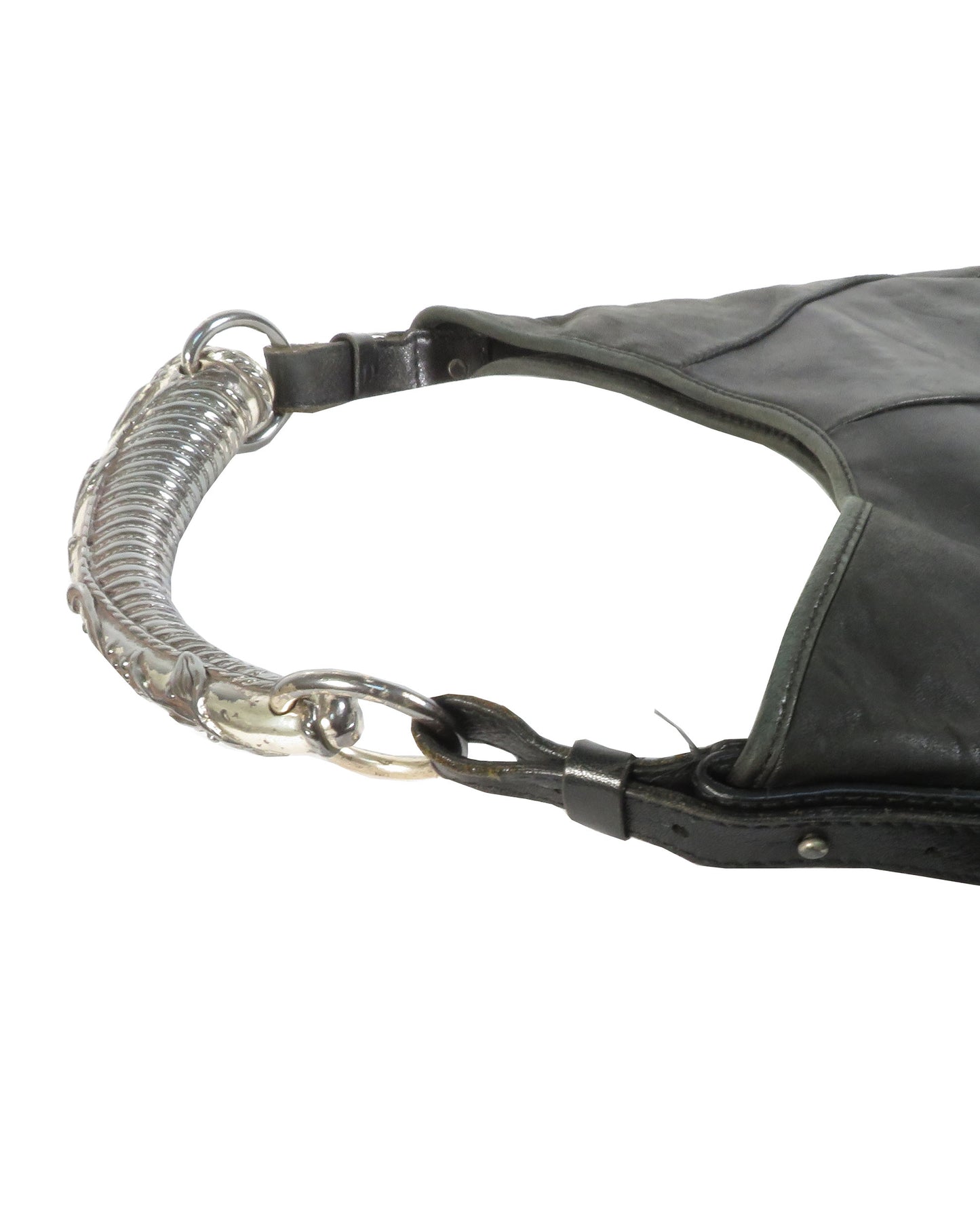 Black leather bag with a coiled spring handle on a white background
