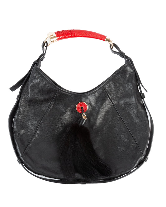 Black leather Yves Saint Laurent Mombasa shoulder bag with red embossed handle and gold-tone hardware, featuring a fur tassel.