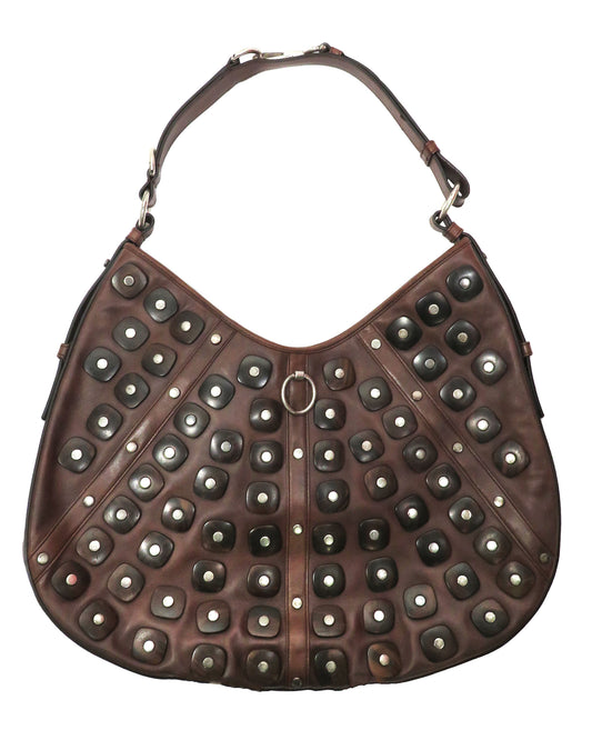 Brown handbag with silver studs on a white background