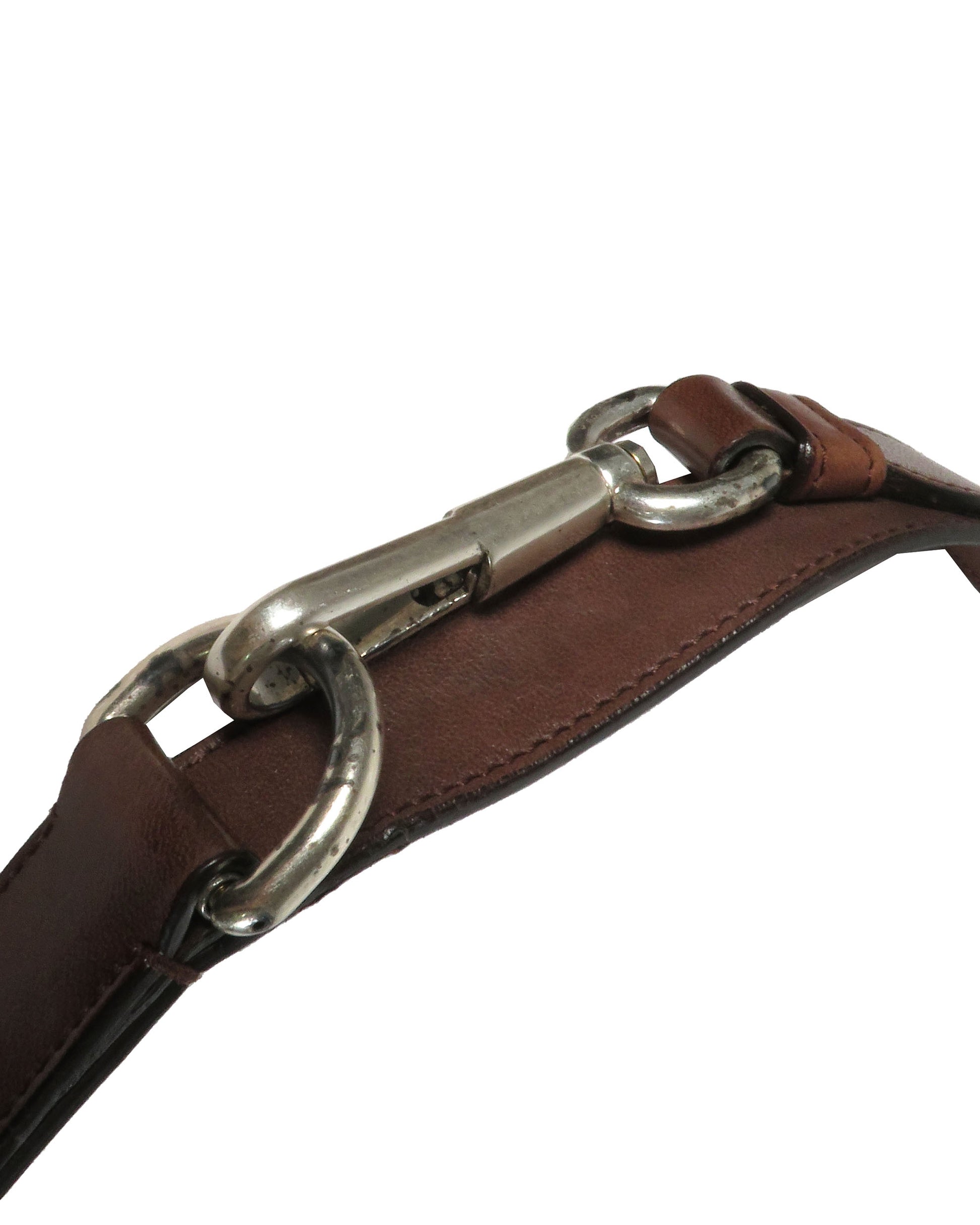 Brown leather bridle with a silver bit on a white background