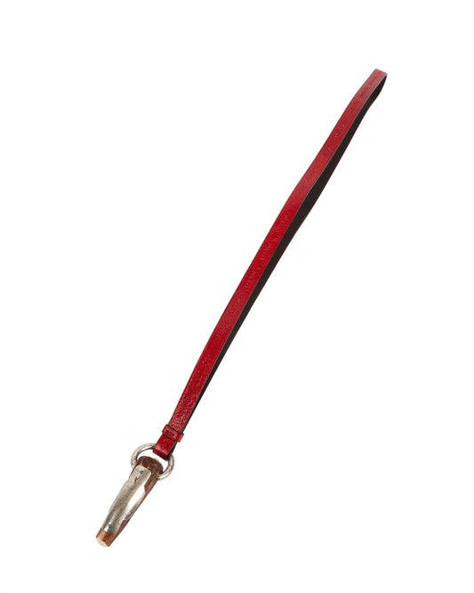 A red leather strap with a silver-tone ring and a natural horn pendant with metal detailing.