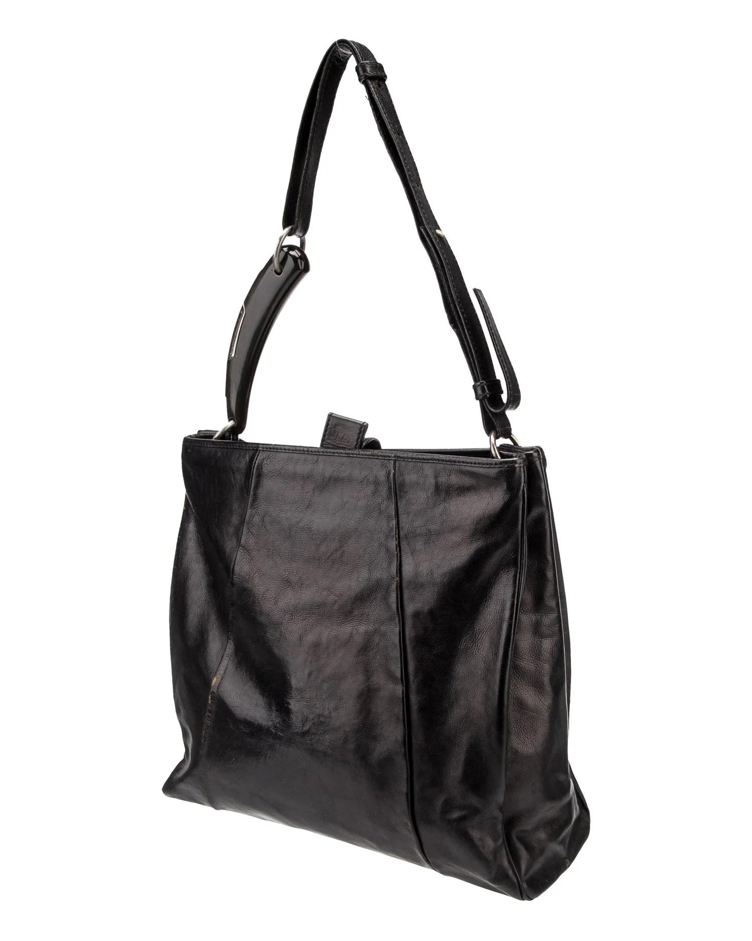 Black handbag with a shoulder strap on a white background