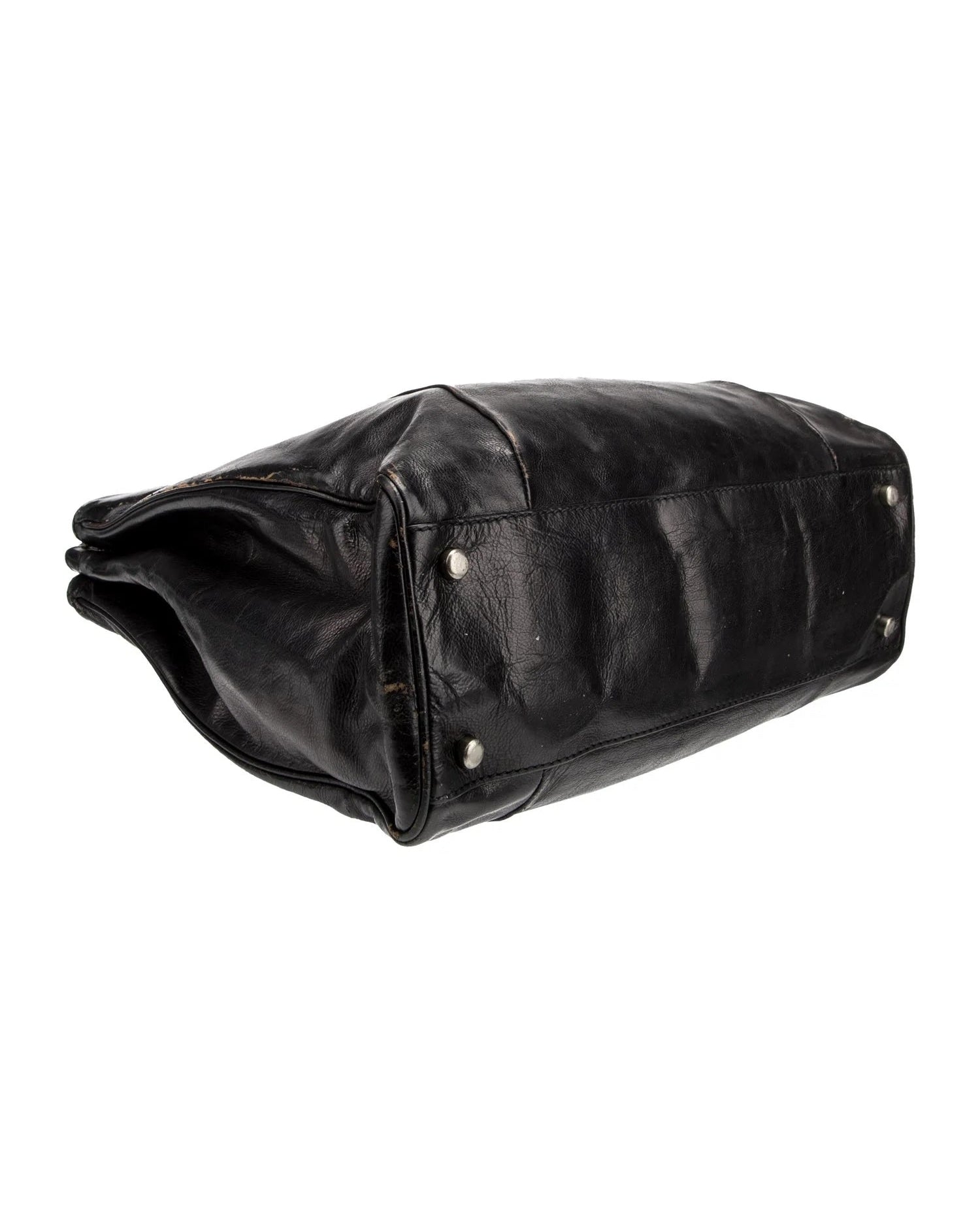 Black leather bag with studs on a white background