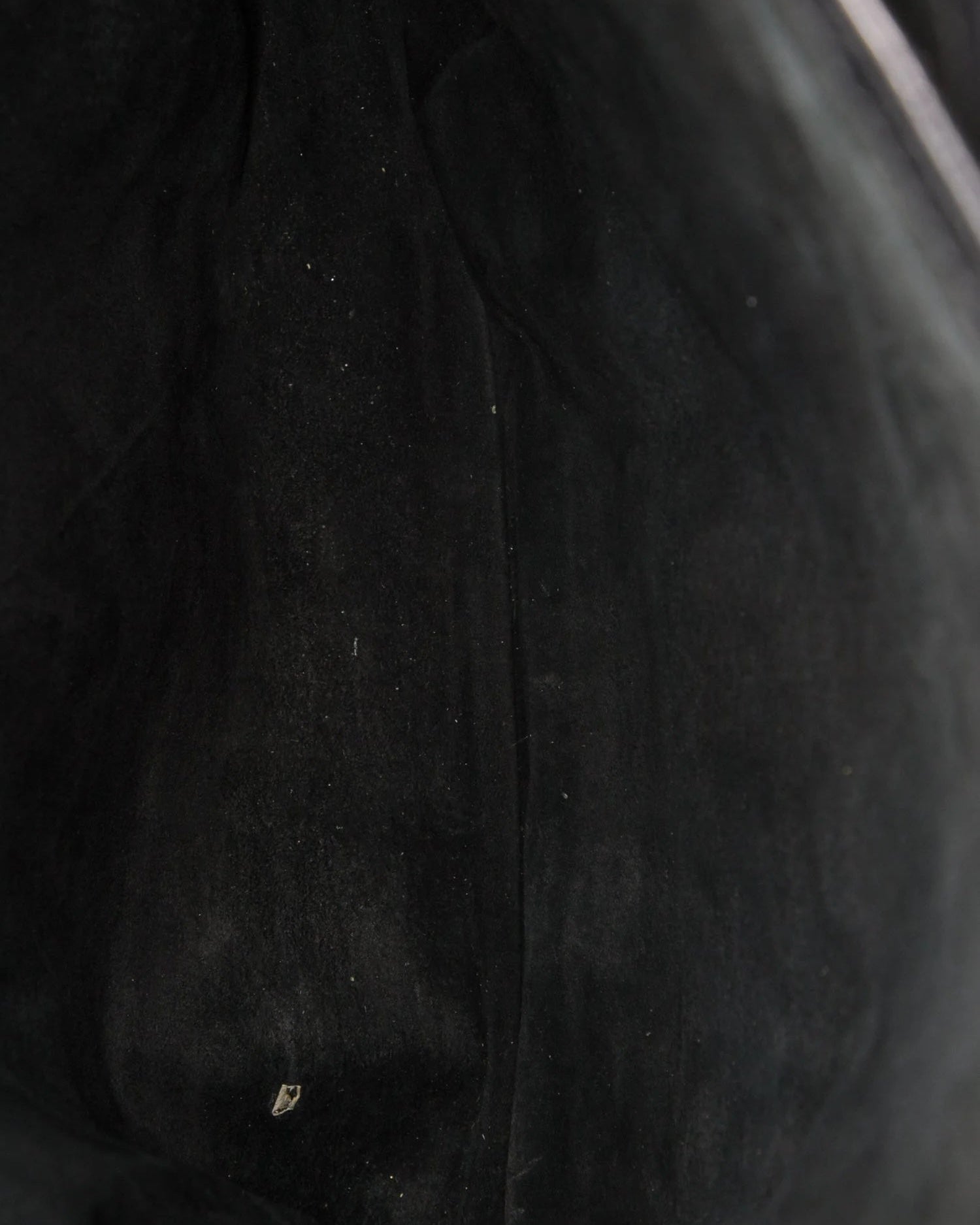 Close-up of a textured black fabric surface